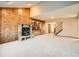 Living room with a fireplace and stairway at 6141 W Evans Pl, Lakewood, CO 80227