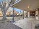 Covered patio perfect for outdoor entertaining, overlooks backyard and garden at 6141 W Evans Pl, Lakewood, CO 80227