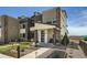 Charming townhome with stone accents, covered porch, and manicured landscaping at 6864 Bryant Ct, Denver, CO 80221
