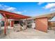 Relaxing backyard patio with covered seating area, perfect for outdoor entertaining at 2095 Newland St, Edgewater, CO 80214