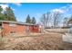 Large backyard with a brick ranch house, offering plenty of space at 2095 Newland St, Edgewater, CO 80214