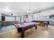 Finished basement featuring a pool table, bar, and lounge area at 2095 Newland St, Edgewater, CO 80214