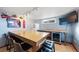 Basement wet bar with seating and mini-fridge at 2095 Newland St, Edgewater, CO 80214