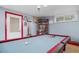 Game room features a pool table and ample space for entertainment at 2095 Newland St, Edgewater, CO 80214
