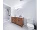 Updated bathroom features a double vanity, soaking tub, and shower at 2095 Newland St, Edgewater, CO 80214