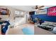 Unique bedroom featuring a ceiling fan, window, and cozy decor at 2095 Newland St, Edgewater, CO 80214