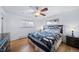 Spacious bedroom with hardwood floors, ceiling fan, and ample natural light at 2095 Newland St, Edgewater, CO 80214