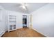 Bedroom with hardwood floors, closet, and built-in shelving at 2095 Newland St, Edgewater, CO 80214