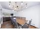Bright dining room featuring a modern chandelier and large dining table at 2095 Newland St, Edgewater, CO 80214
