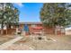 Brick ranch home with landscaped yard and inviting front porch at 2095 Newland St, Edgewater, CO 80214