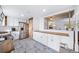 Updated kitchen features stainless steel appliances and white cabinets at 2095 Newland St, Edgewater, CO 80214