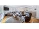 Open concept living room with hardwood floors and a view of the dining area at 2095 Newland St, Edgewater, CO 80214