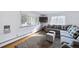 Spacious living room featuring a cozy sectional sofa and hardwood floors at 2095 Newland St, Edgewater, CO 80214
