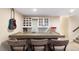 Basement wet bar with wine rack, cabinets and popcorn machine at 3140 S Nepal Way, Aurora, CO 80013