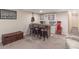 Basement bar with seating, wine storage and a view of the hallway at 3140 S Nepal Way, Aurora, CO 80013