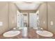 Bathroom with double sinks and a view into another room at 3140 S Nepal Way, Aurora, CO 80013