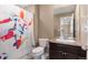 Full bathroom with shower and a fun patterned shower curtain at 3140 S Nepal Way, Aurora, CO 80013