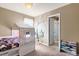 Bedroom with built-in bed, wall mural and adjacent bathroom at 3140 S Nepal Way, Aurora, CO 80013