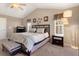 Main bedroom with vaulted ceilings, carpet, and ceiling fan at 3140 S Nepal Way, Aurora, CO 80013