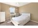 Secondary bedroom with window and white bed at 3140 S Nepal Way, Aurora, CO 80013