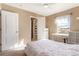Bedroom with window, desk, and access to a bathroom at 3140 S Nepal Way, Aurora, CO 80013