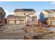 Charming two-story home with a three-car garage, covered porch, and well-maintained landscaping on a sunny day at 3140 S Nepal Way, Aurora, CO 80013
