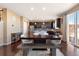 Kitchen with dark cabinets, stainless steel appliances, and breakfast bar at 3140 S Nepal Way, Aurora, CO 80013