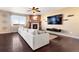 Inviting living room featuring a fireplace, comfortable sofa, and a large TV for entertainment at 3140 S Nepal Way, Aurora, CO 80013