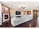 Modern living room with a fireplace, sleek furniture, and dark hardwood floors at 3140 S Nepal Way, Aurora, CO 80013
