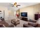 Open loft area with seating, TV and a view of the upstairs hallway at 3140 S Nepal Way, Aurora, CO 80013