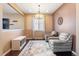 Cozy sitting area with two armchairs, a decorative rug, and ample natural light creates an inviting space at 3140 S Nepal Way, Aurora, CO 80013