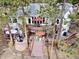 Multi-tiered deck, perfect for entertaining and relaxation, with a fire pit, patio furniture, and umbrellas for shade at 24860 N Mountain Park Dr, Evergreen, CO 80439