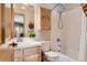 Traditional bathroom features a shower-tub combination with decorative cabinet storage and vanity at 24860 N Mountain Park Dr, Evergreen, CO 80439