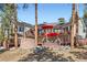 Multi-level deck with outdoor seating areas, accessed by stairs with stone wall details at 24860 N Mountain Park Dr, Evergreen, CO 80439