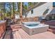 Unwind in this hot tub on a multilevel deck, surrounded by trees and offering ultimate relaxation at 24860 N Mountain Park Dr, Evergreen, CO 80439