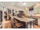 Bright kitchen boasts large island, granite countertops, stainless steel appliances, and eat in dining at 24860 N Mountain Park Dr, Evergreen, CO 80439