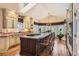 Bright kitchen boasts large island, granite countertops, stainless steel appliances, and eat in dining at 24860 N Mountain Park Dr, Evergreen, CO 80439