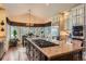 Bright kitchen boasts large island, granite countertops, stainless steel appliances, and eat in dining at 24860 N Mountain Park Dr, Evergreen, CO 80439