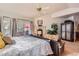 Spacious main bedroom offers a fireplace, sitting area, and access to the outside at 24860 N Mountain Park Dr, Evergreen, CO 80439