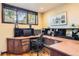 A well-appointed office space with built-in desk, drawers and natural light at 24860 N Mountain Park Dr, Evergreen, CO 80439