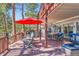Expansive wooden deck with multiple seating areas, offering the perfect spot for entertaining guests outdoors at 24860 N Mountain Park Dr, Evergreen, CO 80439