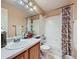 Well-lit bathroom features a combined bathtub and shower, plus a functional single sink vanity at 3859 Rawhide Cir, Castle Rock, CO 80104