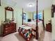 Charming bedroom with a four-poster bed and cozy decor, creating a warm and inviting space at 3859 Rawhide Cir, Castle Rock, CO 80104