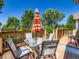 Outdoor deck with a dining table and chairs, providing a relaxing space for outdoor dining and entertainment at 3859 Rawhide Cir, Castle Rock, CO 80104