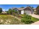 Charming single-Gathering home with a well-maintained front yard and inviting curb appeal at 3859 Rawhide Cir, Castle Rock, CO 80104