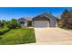 Charming single-Gathering home featuring a well-manicured lawn and a convenient three-car garage at 3859 Rawhide Cir, Castle Rock, CO 80104