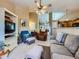 Cozy living room with a neutral color palette, comfortable seating, and an open floor plan at 3859 Rawhide Cir, Castle Rock, CO 80104
