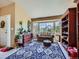 Inviting living area with a bay window offering natural light, comfortable seating, and stylish décor at 3859 Rawhide Cir, Castle Rock, CO 80104