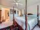 Spacious primary bedroom featuring a four poster bed and an ensuite bathroom at 3859 Rawhide Cir, Castle Rock, CO 80104