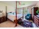 Spacious main bedroom featuring a four-poster bed and ample natural light at 3859 Rawhide Cir, Castle Rock, CO 80104